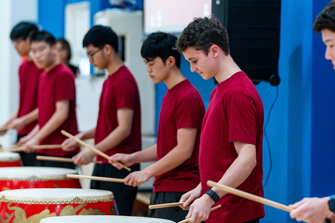 Tanglin students celebrating Red & Gold Day with a Drum performance