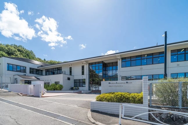 An exterior view of Hiroshima International School multi-story building.