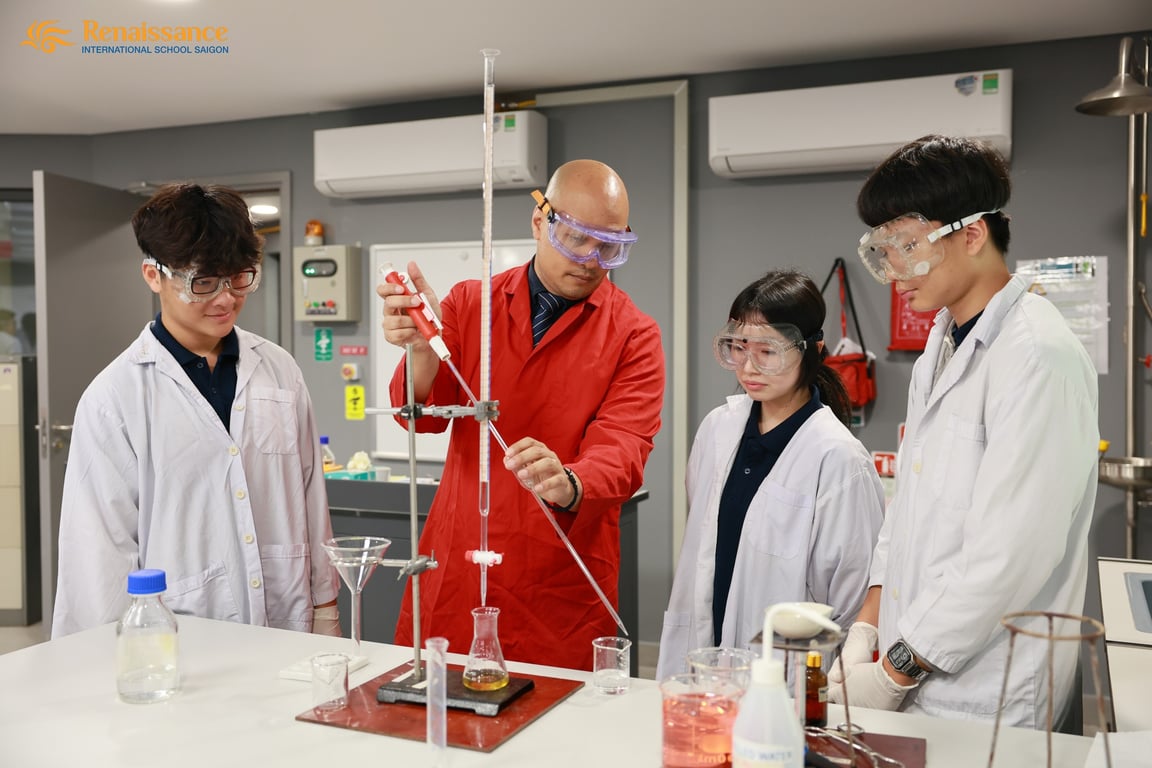 High school students observe a chemistry demonstration during lab class.