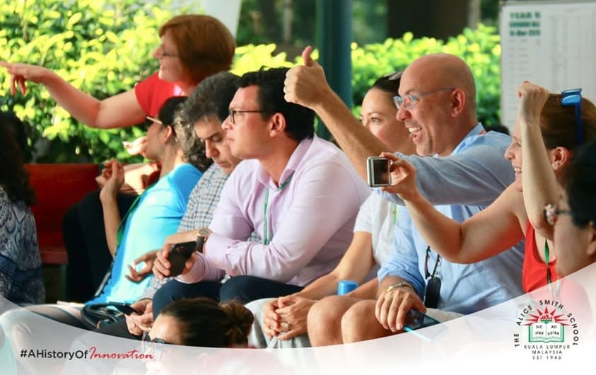 Parents in attendance, watching their children perform.
