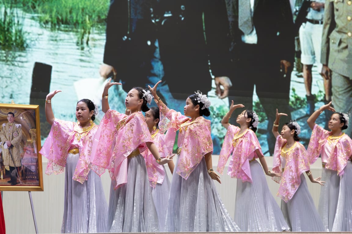 Students performing on stage during Father's day.