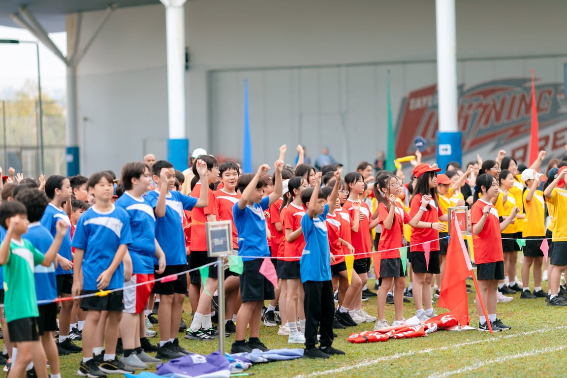 Students proudly represent their Houses in Blue, Green, Yellow and Red during Sports Day.