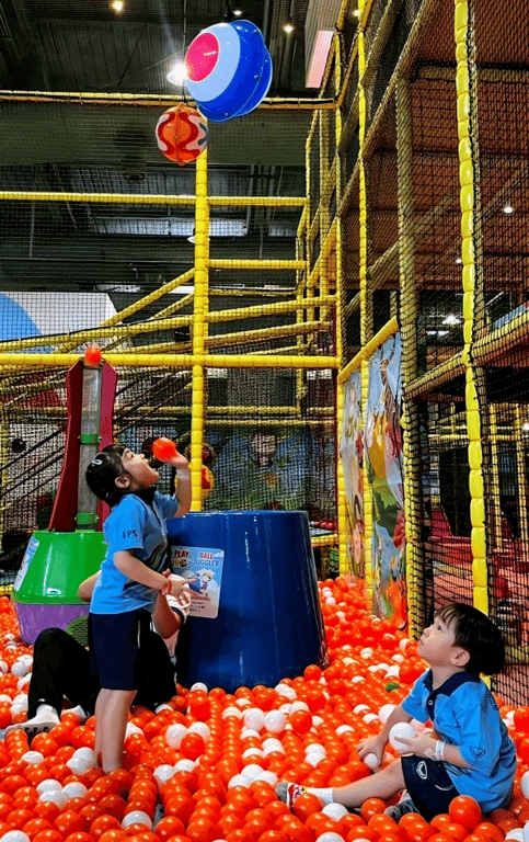 Students enjoy activities at the indoor play area.