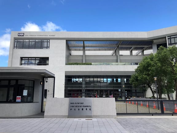 The main entrance and modern academic building of Asia American International Academy.