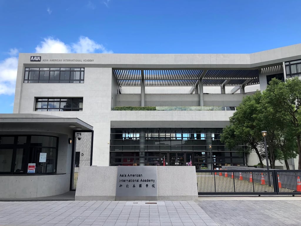 The main entrance and modern academic building of Asia American International Academy.