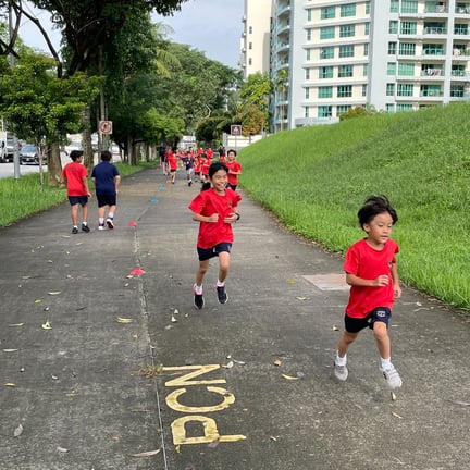 Students competing in a race as part of a PE Lesson