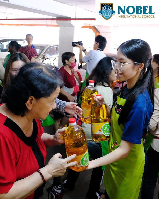 Students giving out donations from the founders Day Celebration.