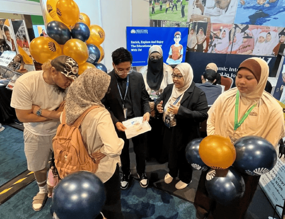 Prospective parents being counselled in an education fair. 