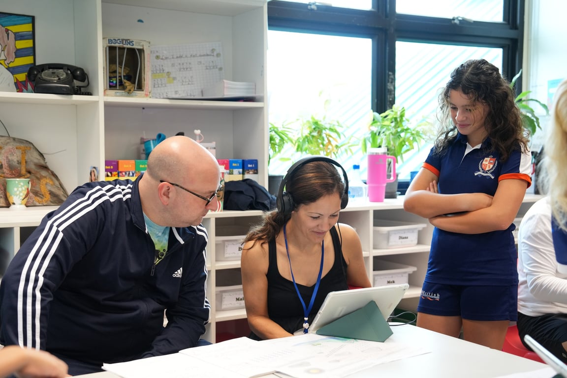 Parents engaging with student projects during Year 4’s open classroom on water sustainability.