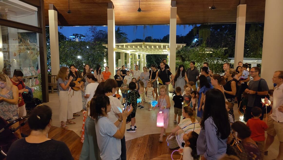 Parents and students celebrated Martin's Day by lighting lanterns and singing traditional songs, at the Singapore Botanic Garden