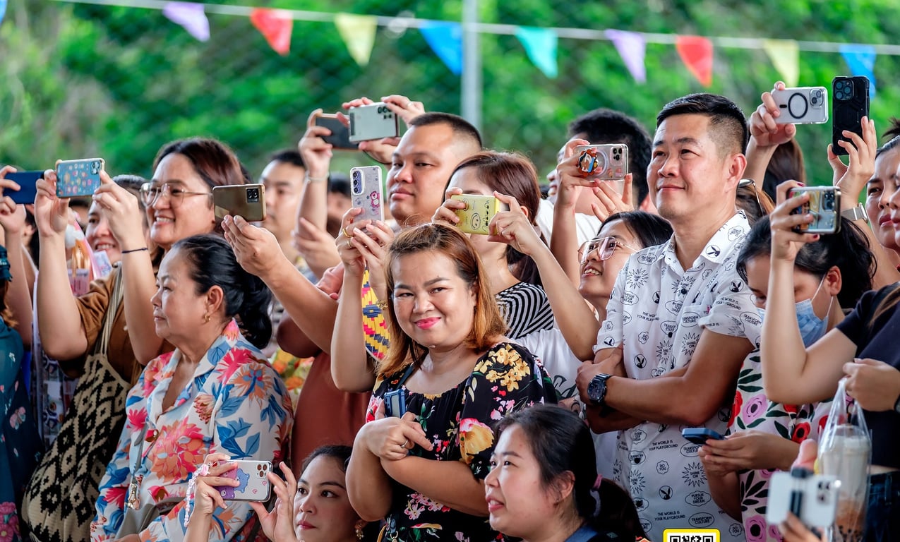 Families at a community event organized by REPS.