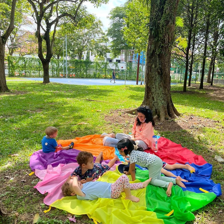 Students playing in the local Telok Kurau Park as  Outdoor play is prioritised on Fridays