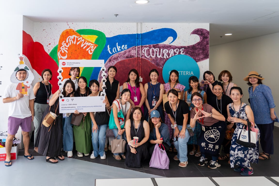 The PEACC pose for a group photo at a fundraising event at the school
