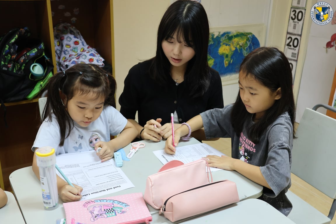 Students working on a nutrition worksheet with teacher assistance.