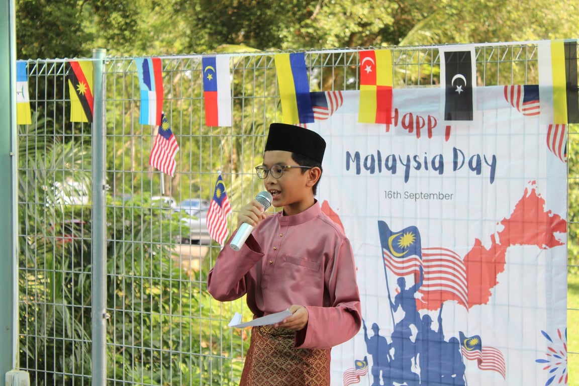 A student delivers a speech during the school’s Malaysia Day celebration.
