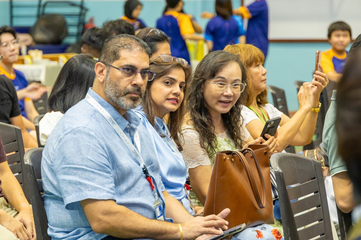 Parents attending the graduation ceremony at school.