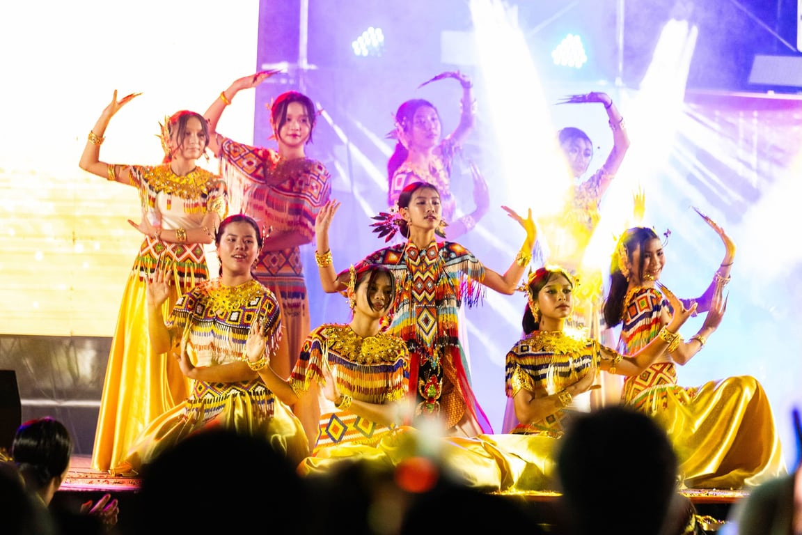 Students performing a traditional dance for Thai Cultural Day.