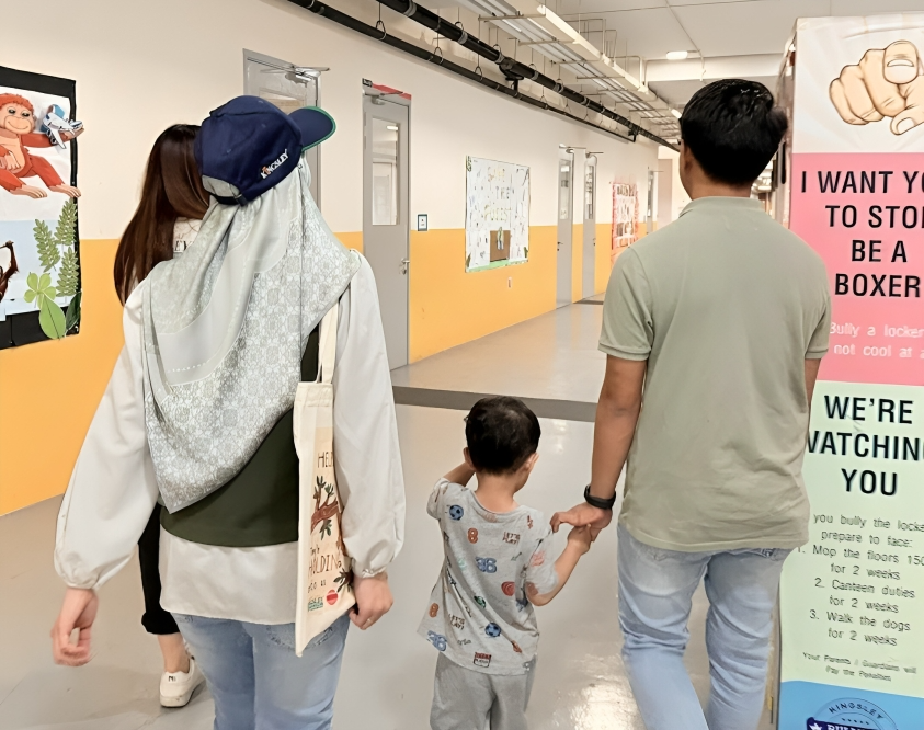 Families touring the school corridors during Coffee Meet event.