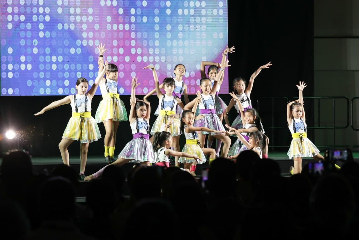 Primary students performing a choreographed dance.