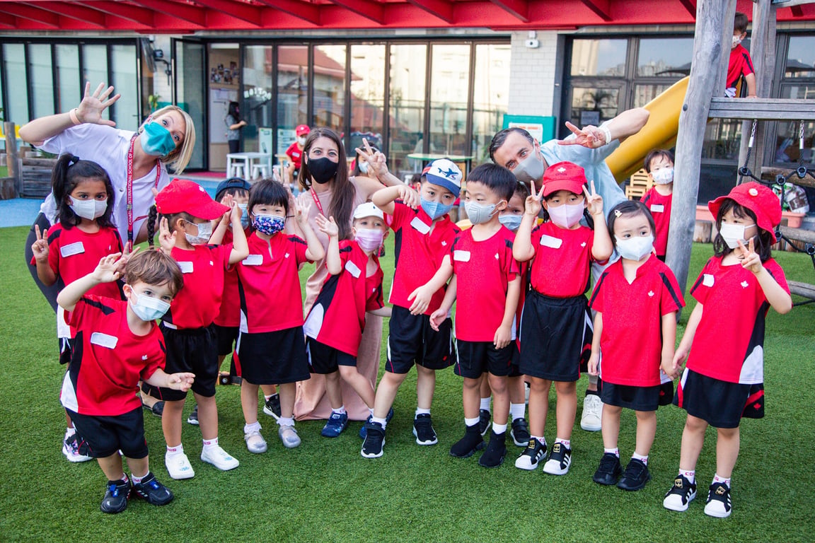 Early Years students posing with teachers on World Teachers’ Day.