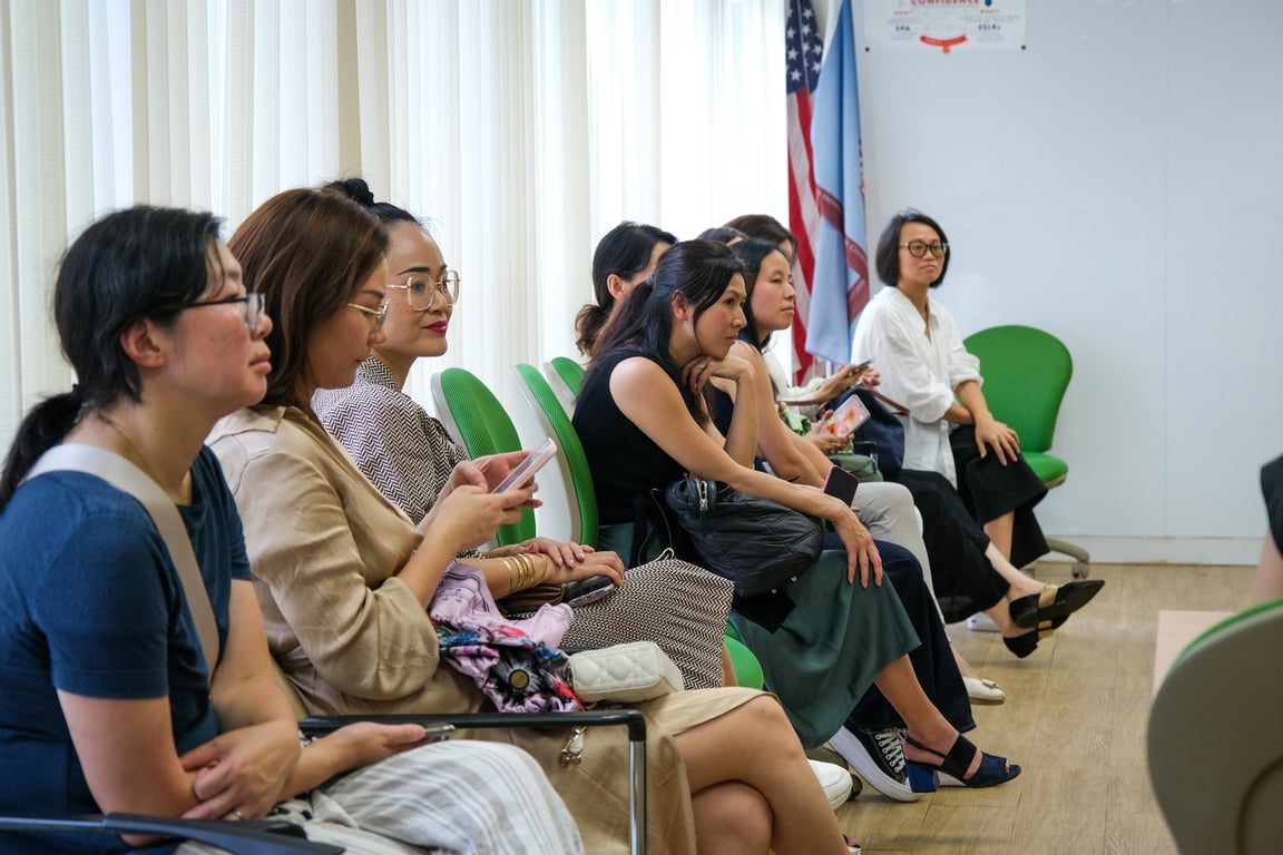 Parents attending a PTA meeting.