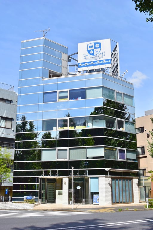 The modern glass-front campus building of Yoyogi International School.
