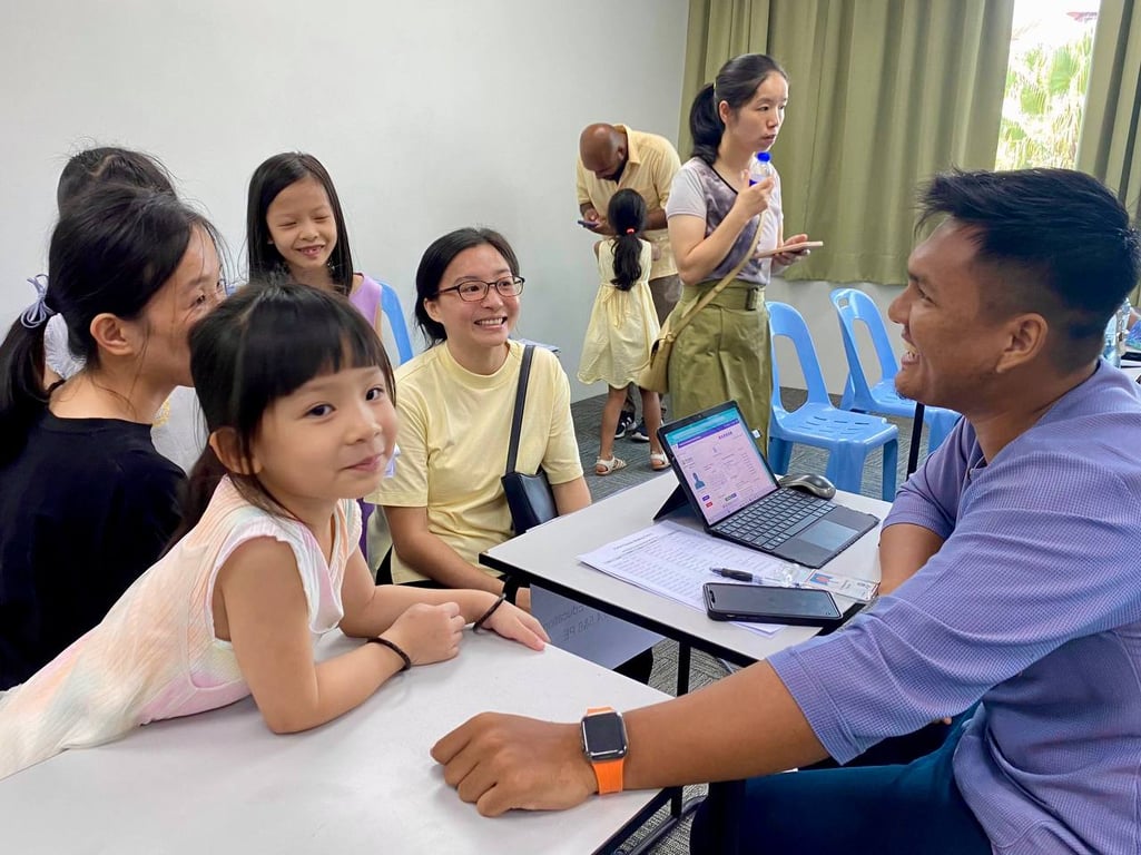 Parents meeting staff during school registration day
