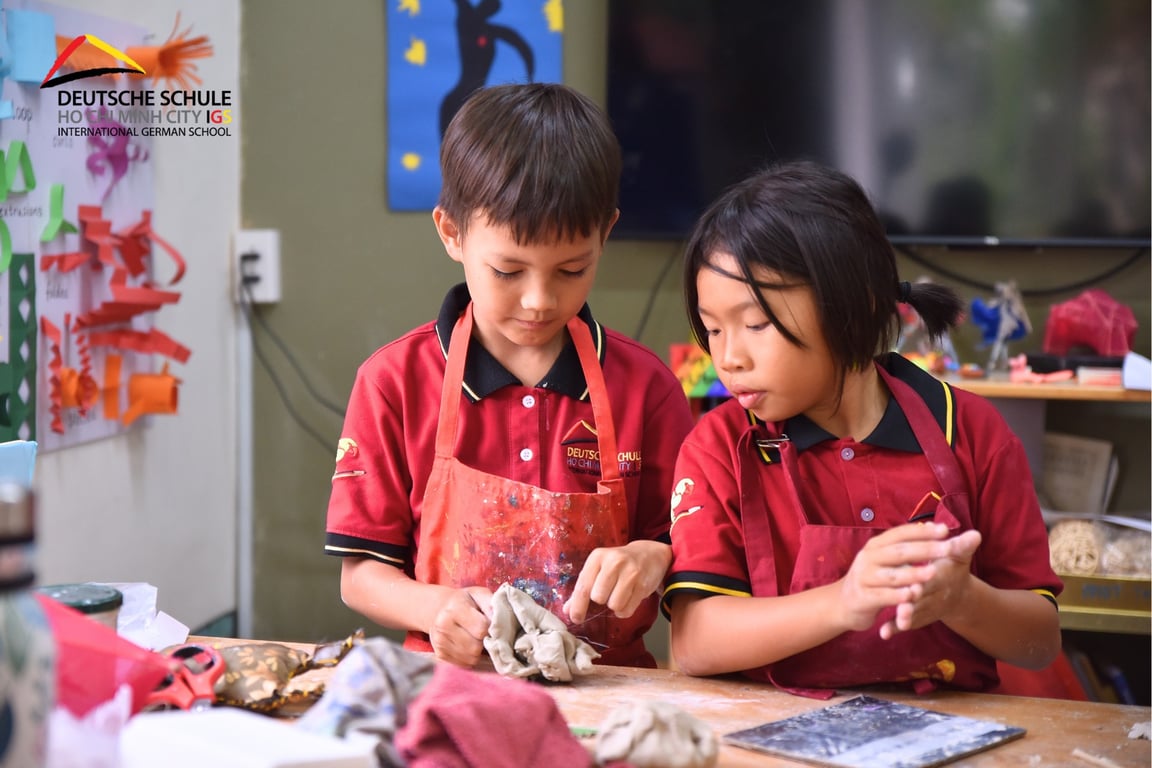 IGS students shape clay projects during a hands-on art class activity.