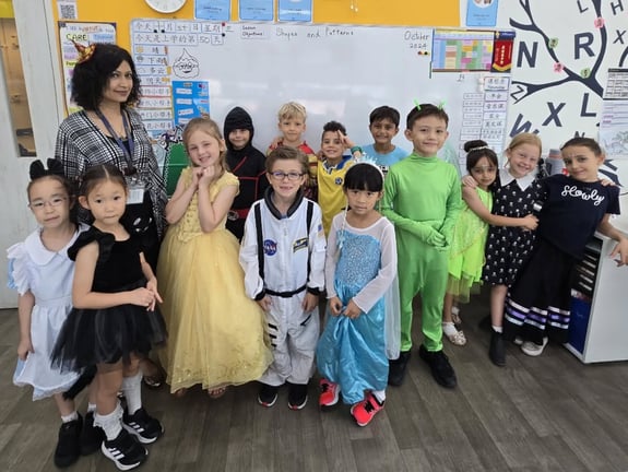 Students posing for a photo after getting dressed up for Halloween