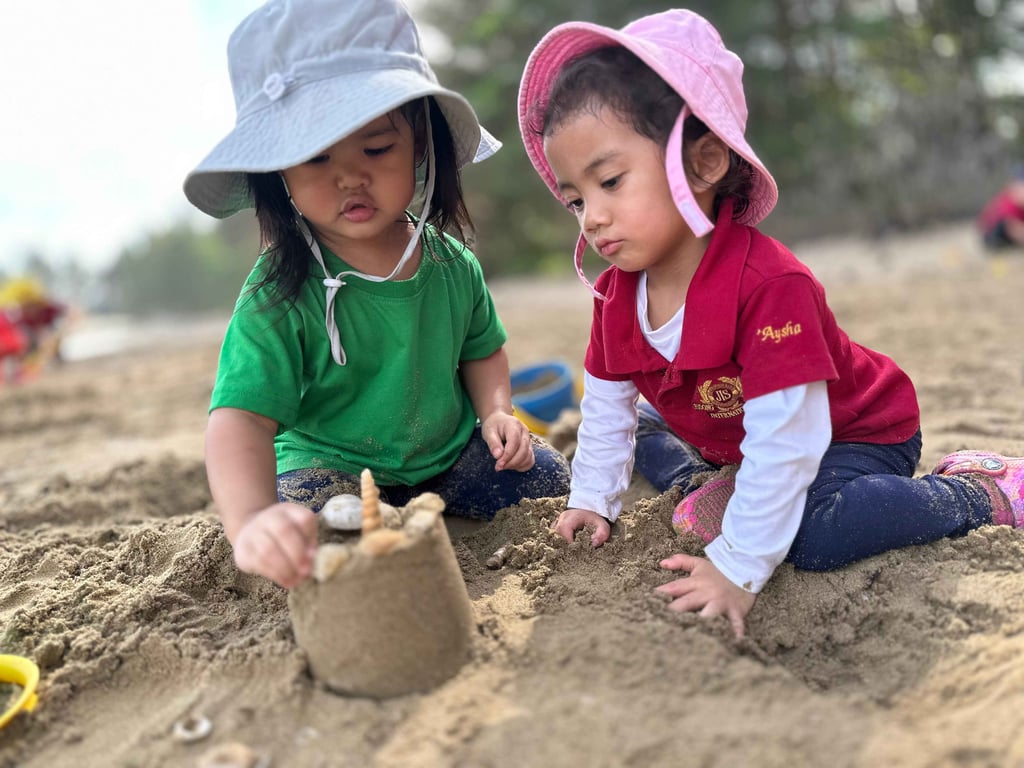 Early Years students explore the Brunei shoreline as part of a nature-based learning experience.