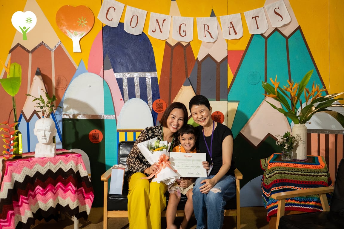 Students and families celebrating during the moving-on ceremonies at Panyaden.