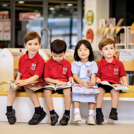 Young learners at Dulwich College International School enjoy picture books together, building early literacy skills.