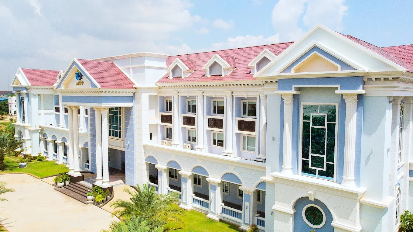The primary academic wing of Australian International School Phnom Penh under clear skies.