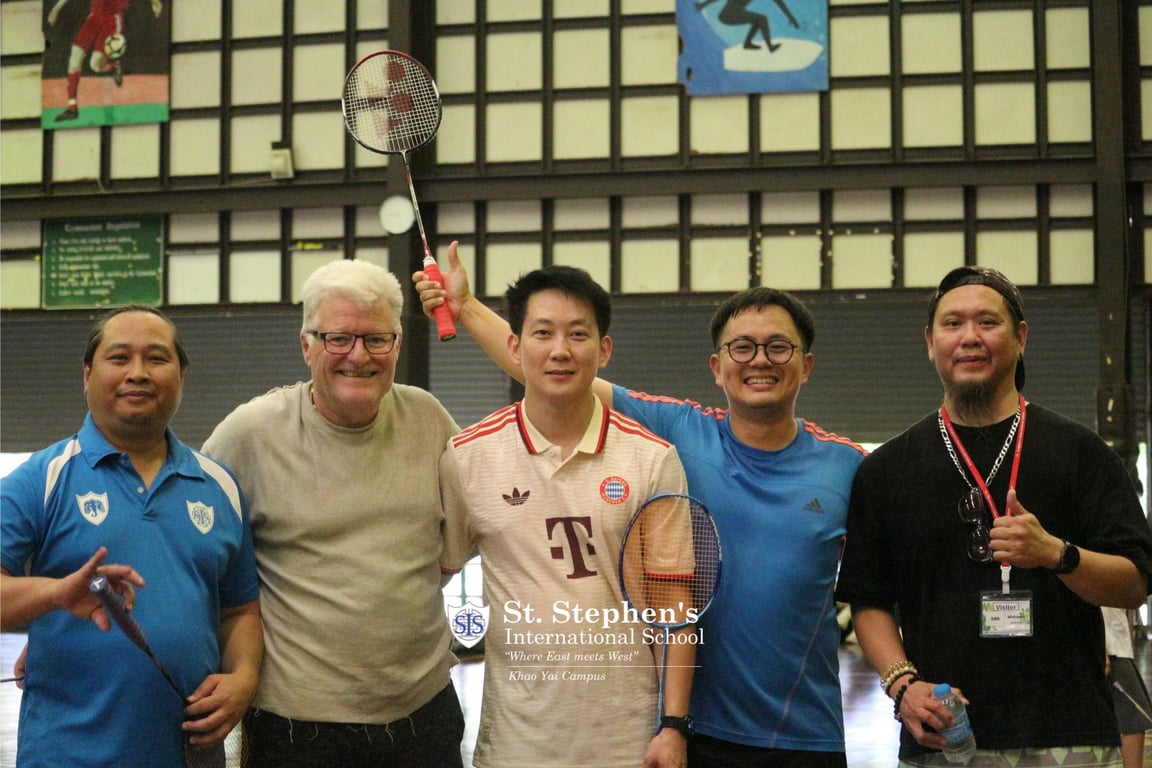 Parents and teachers competing in the badminton tournament.