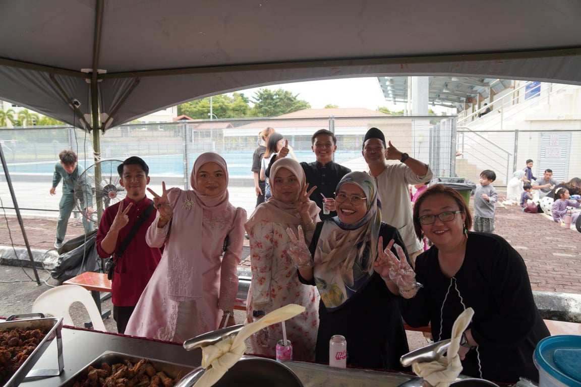 Parents participating in the Hari Raya celebration.