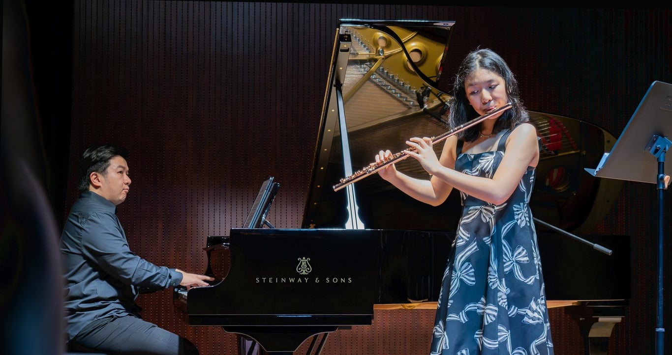 Zhao Chujian and Dr. Bernard Tan put on  'A Flute Journey Through Europe', an evening of enchanting melodies,  for the school community