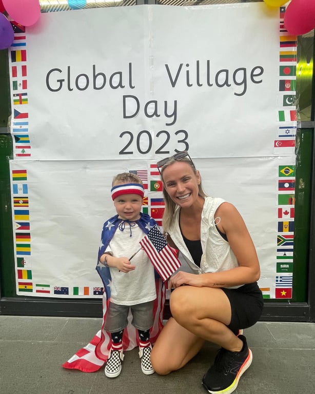 A family posing at the Global Village Day.