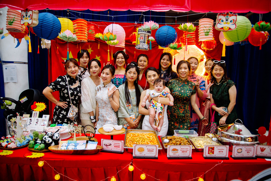 Community members celebrate cultural heritage at a festive food stall during the school's International Day.