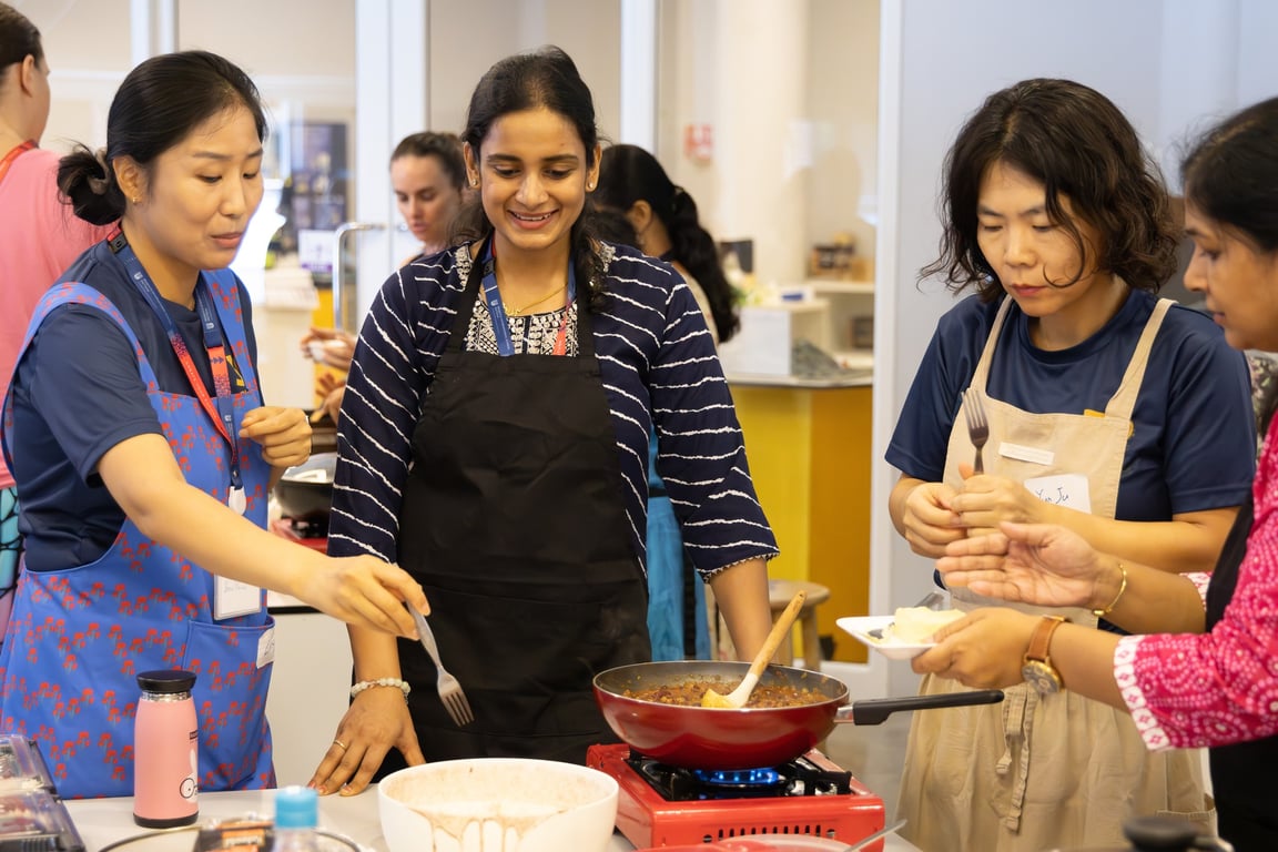 Parents participating in a cooking class hosted by the Parent Supporters Group.