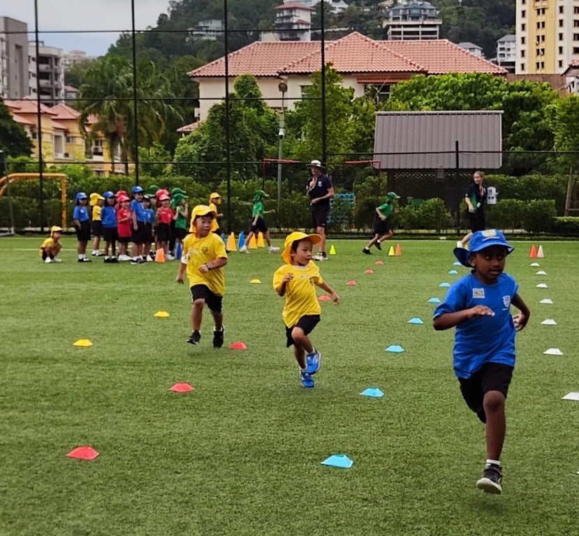 Students participating in a race at the annual sports day.