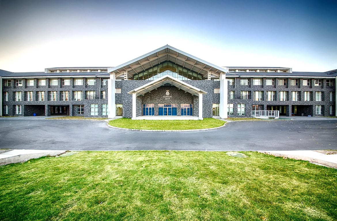 A wide view of the modern campus buildings at Harrow Beijing.