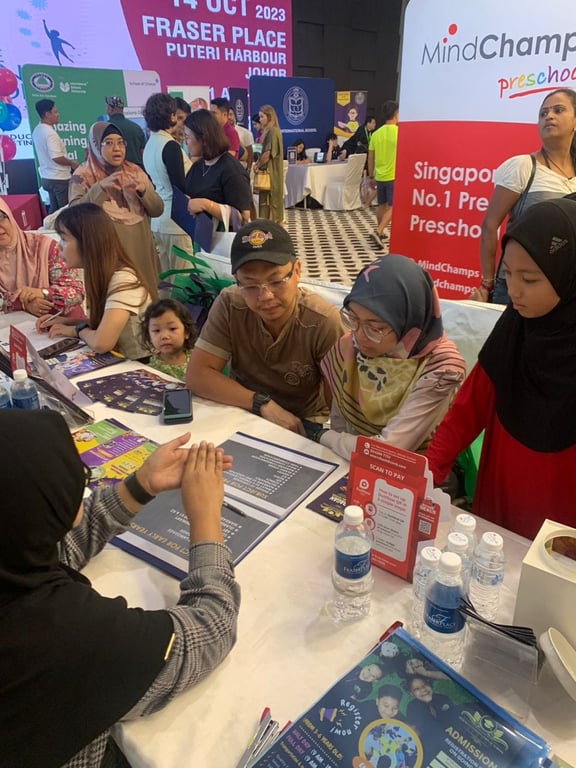 Prospective families being counselled in an education fair.