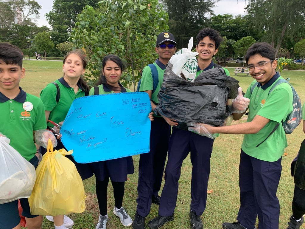 Secondary students take part in a beach clean-up community project as part of their commitment to sustainability.