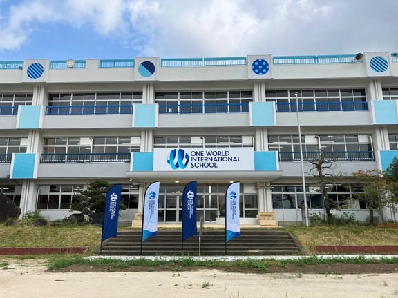 The welcoming main entrance and vibrant blue facade of the Tsukuba campus.