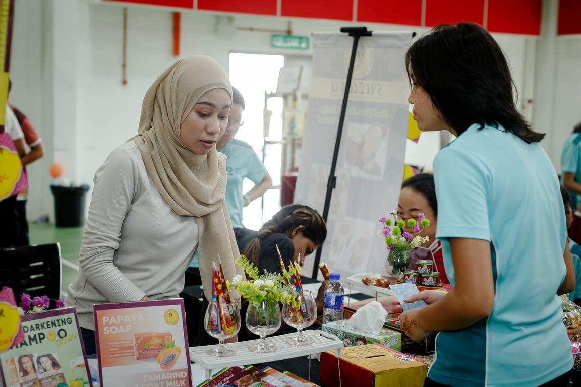 A parent tending to their stall at the SJIS open day and Big Hearts Bazaar.
