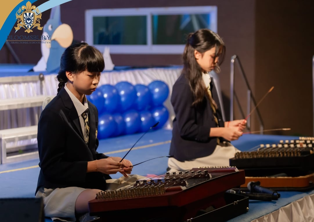 KS2 performers playing instruments during the celebration event.
