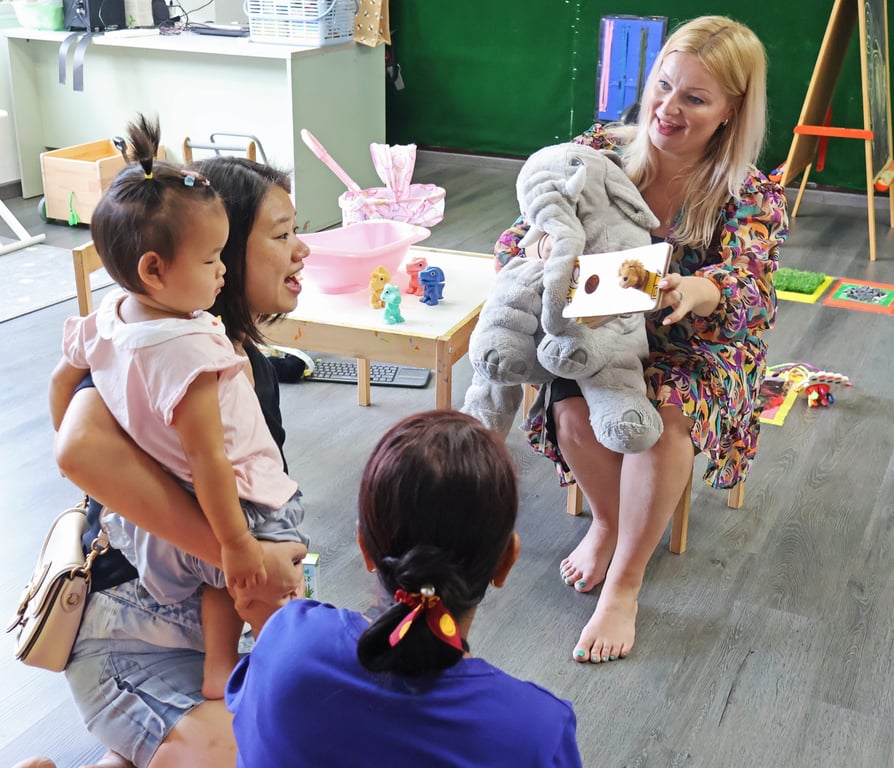 Storytime and songs during weekly toddler playgroup session.