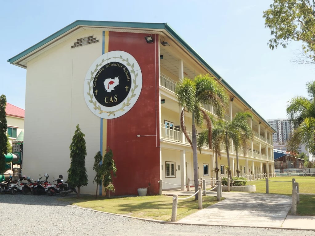 Exteriors view of Cambodia Adventist International School campus building.