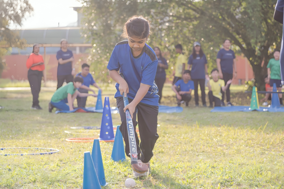 Practicing coordination and focus during a sports activity.