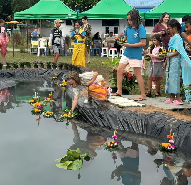 Celebrating Loy Krathong together with student-made floating offerings.